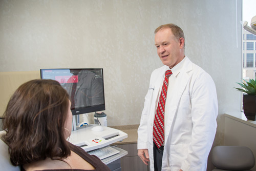 Dr. Osterday discusses sleep apnea treatment with a patient